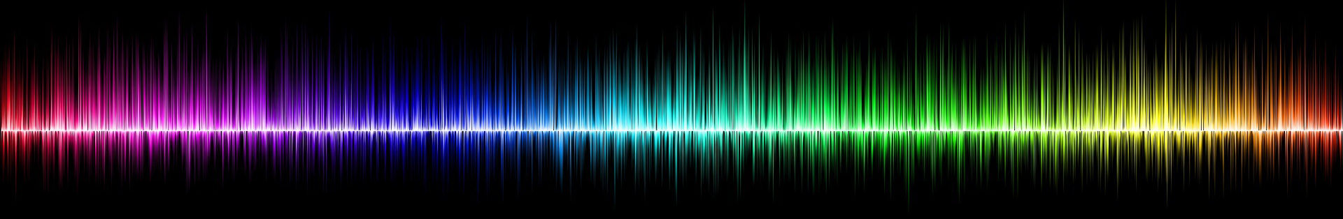 sound waves in rainbow colors with black background